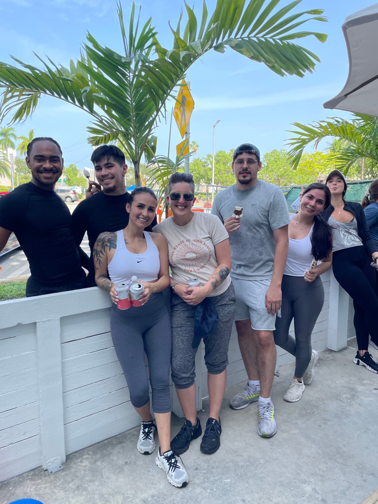 Team members gathered outside on the patio after a shift