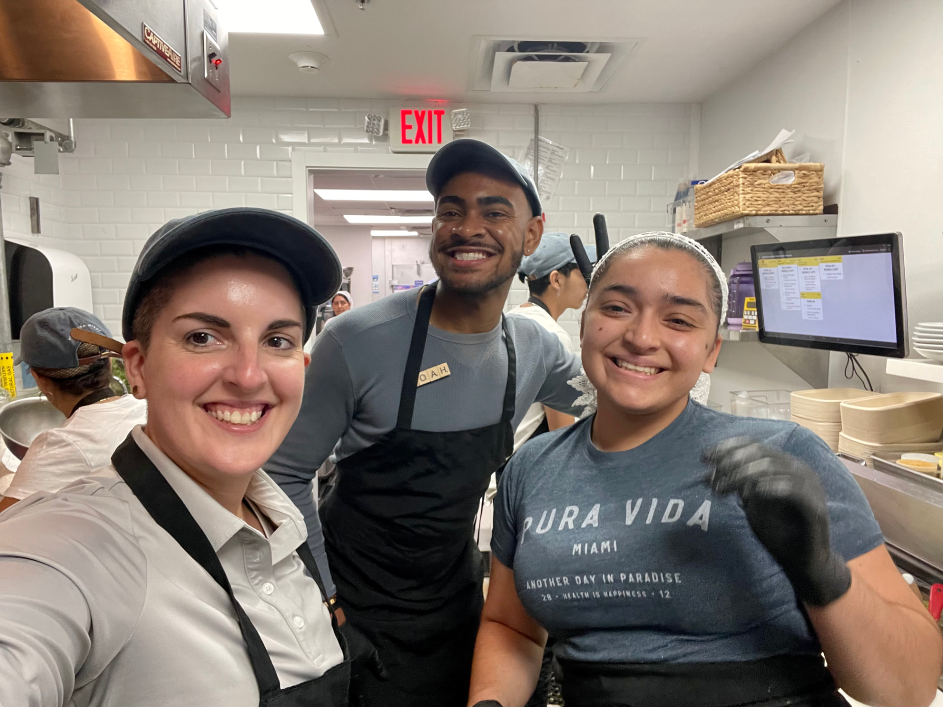 Kitchen team smiling together during service